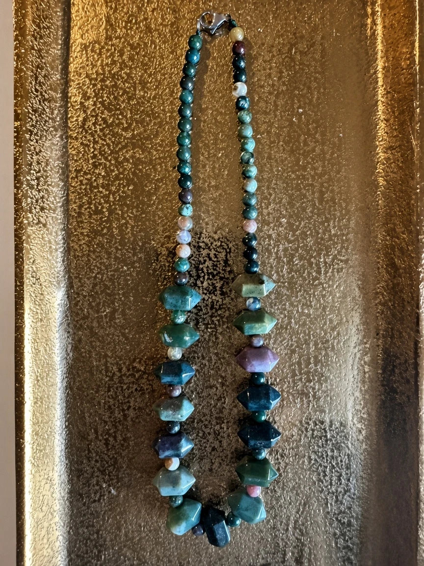 Hue La La Gems beaded necklace featuring faceted green and purple agate stones on a gold textured tray.