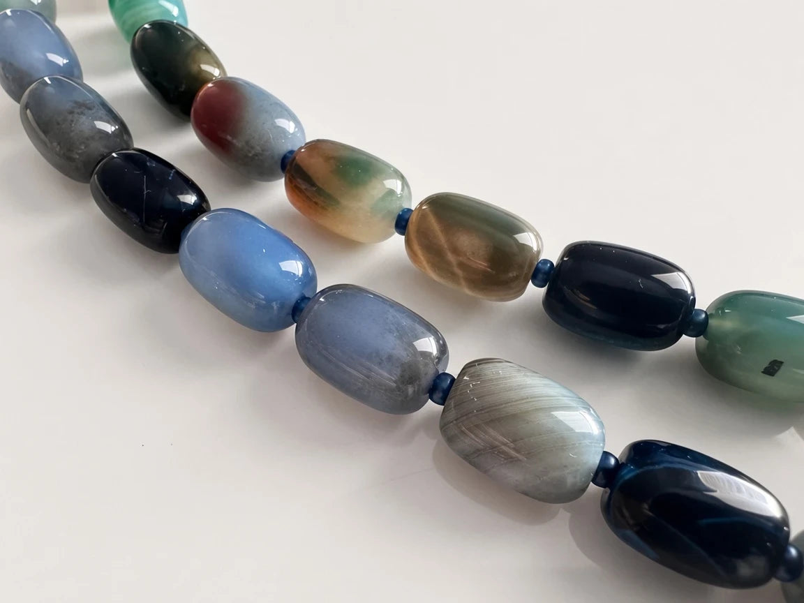 Hue La La Gems multi-colored agate beaded necklace featuring polished oval stones in blue, green, and brown tones.