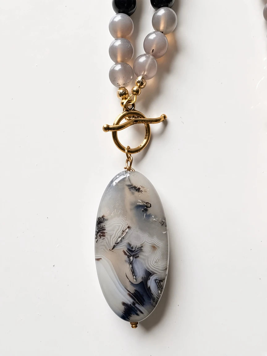 Hue La La Gems beaded statement necklace featuring a large oval grey agate pendant and gold-tone toggle clasp.