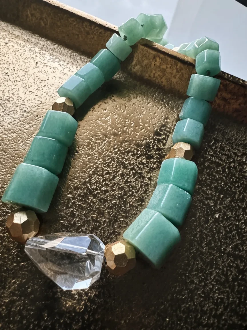 Hue La La Gems statement necklace with seafoam green cube amazonite beads, gold metallic accents, and crystal pendant.