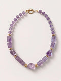 Hue La La Gems amethyst beaded statement necklace with gold-tone accents and a toggle clasp on a neutral background.