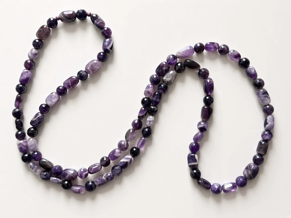 Hue La La Gems handcrafted amethyst beaded necklace featuring polished oval and faceted round violet gemstone beads.