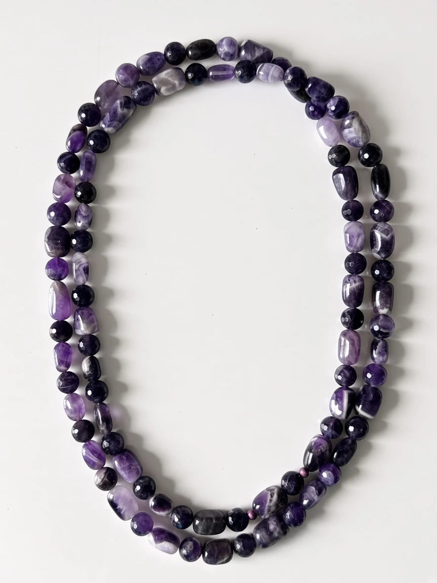 Hue La La Gems handcrafted amethyst beaded necklace featuring polished oval and faceted round violet gemstone beads.