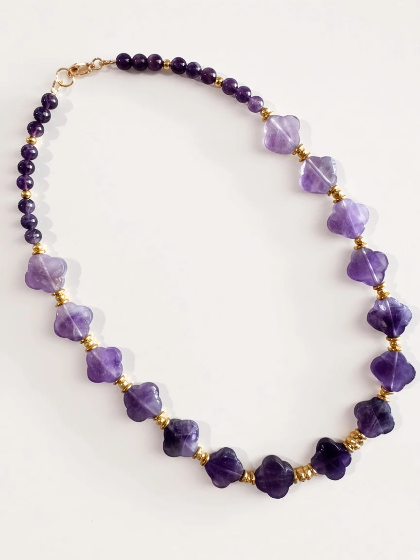 Hue La La Gems amethyst beaded statement necklace with clover-shaped purple stones and gold-tone spacers.