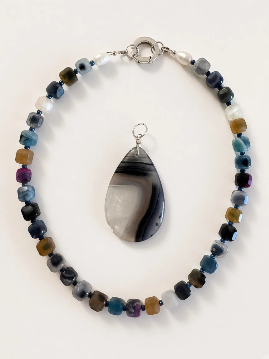 Hue La La Gems handcrafted statement necklace with cube gemstone beads, freshwater pearls, and a teardrop agate pendant.