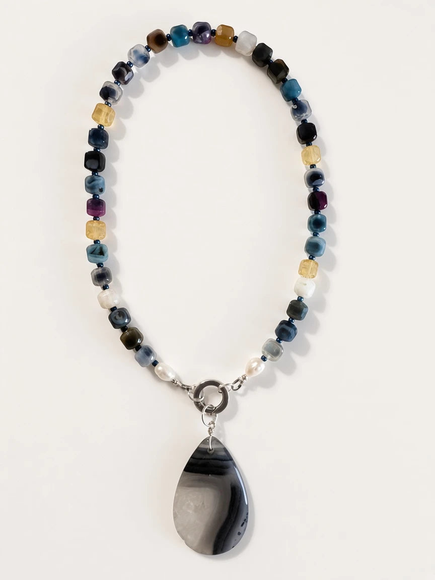 Hue La La Gems handcrafted statement necklace with multi-colored cube gemstone beads, freshwater pearls, and agate pendant