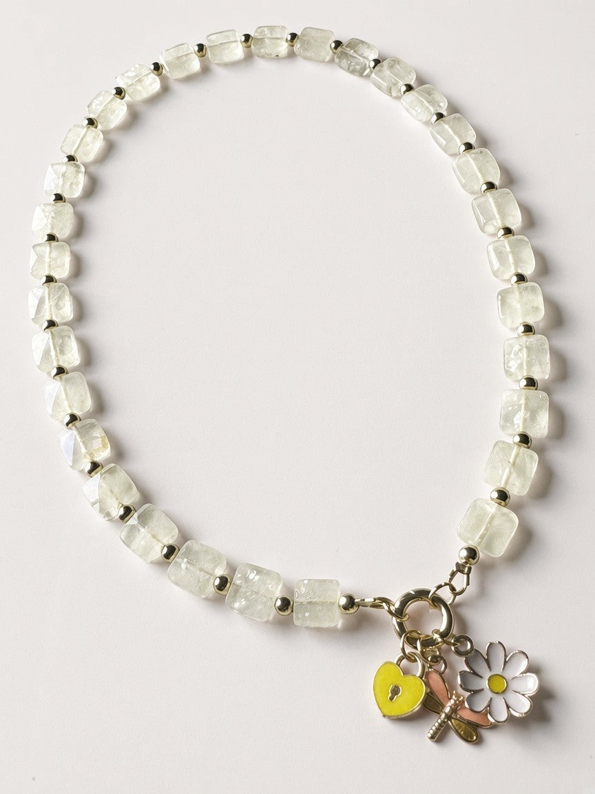 Hue La La Gems beaded necklace with translucent stone beads, gold spacers, and heart, daisy, and dragonfly charms.