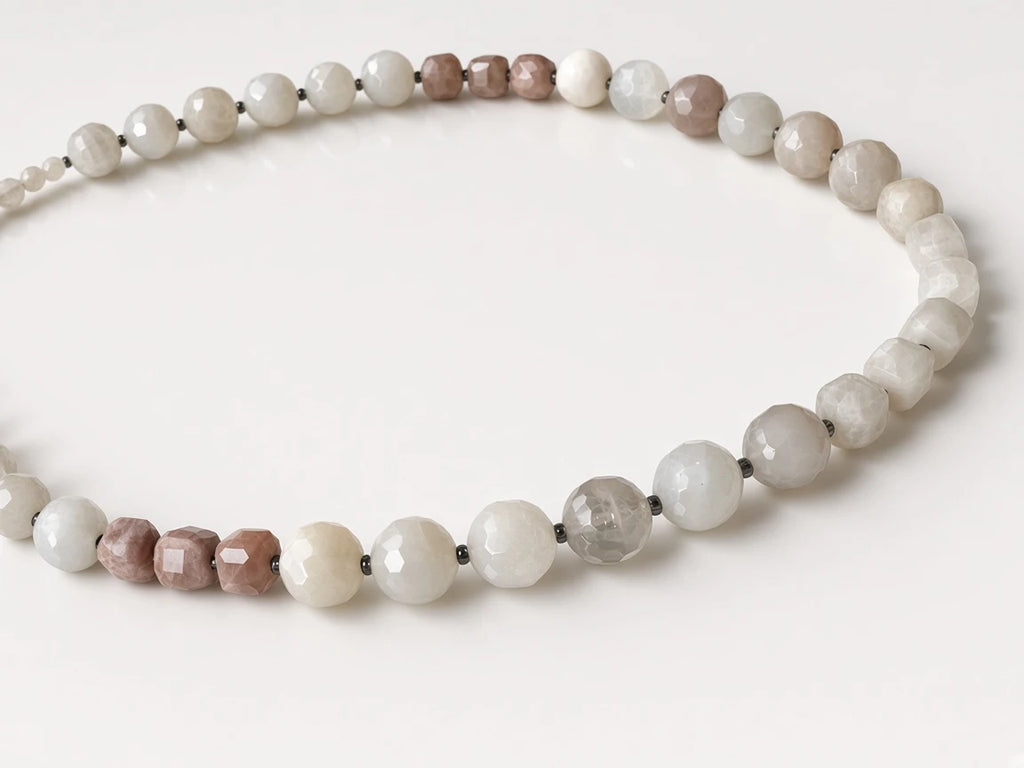 Hue La La Gems beaded statement necklace featuring faceted moonstone and sunstone beads in white, grey, and dusty rose.