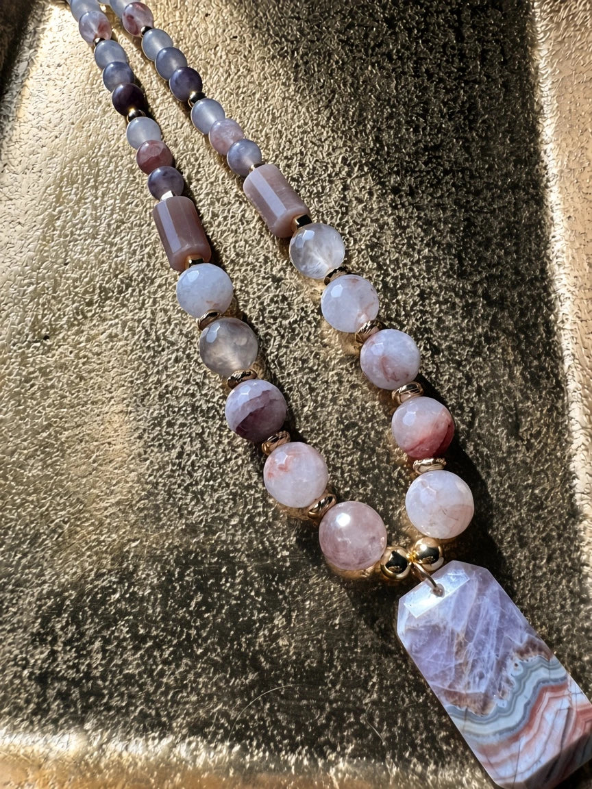 Hue La La Gems beaded statement necklace with pink gemstone beads, gold-tone spacers, and a geometric banded pendant.