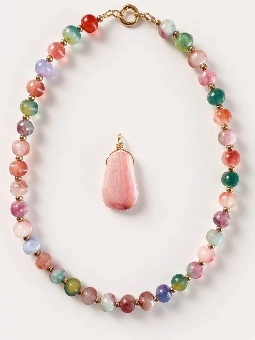 Hue La La Gems multi-colored gemstone beaded necklace with a large faceted pink stone pendant and gold-tone spacers.