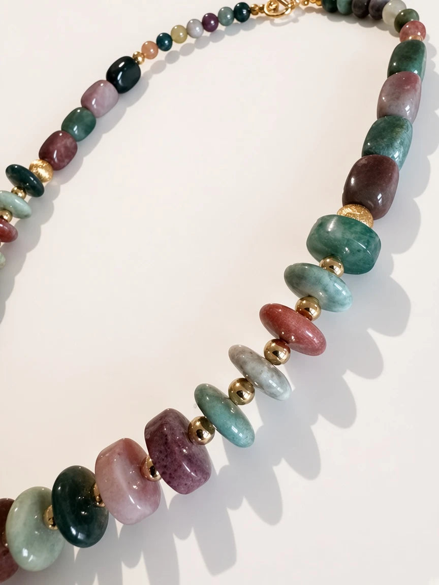 Hue La La Gems beaded statement necklace with polished green, pink, and plum gemstones and gold-tone spacers