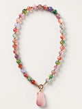 Hue La La Gems multi-colored gemstone beaded necklace with a large faceted pink stone pendant and gold-tone spacers.