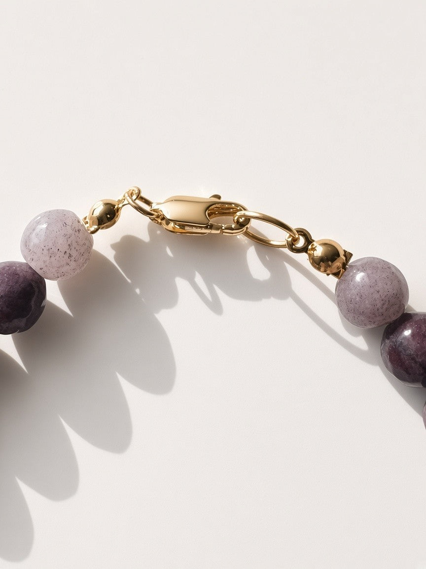 Hue La La Gems beaded necklace featuring purple gemstone beads and a polished gold-tone lobster clasp closure.