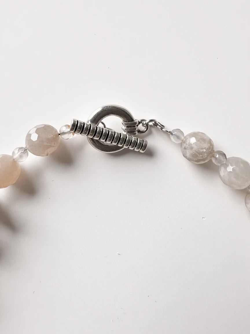 Hue La La Gems handcrafted necklace featuring faceted moonstone-style beads and a silver-toned toggle clasp