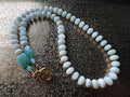 Hue La La Gems beaded necklace with faceted white beads, green gemstone accents, and a gold-tone toggle clasp.