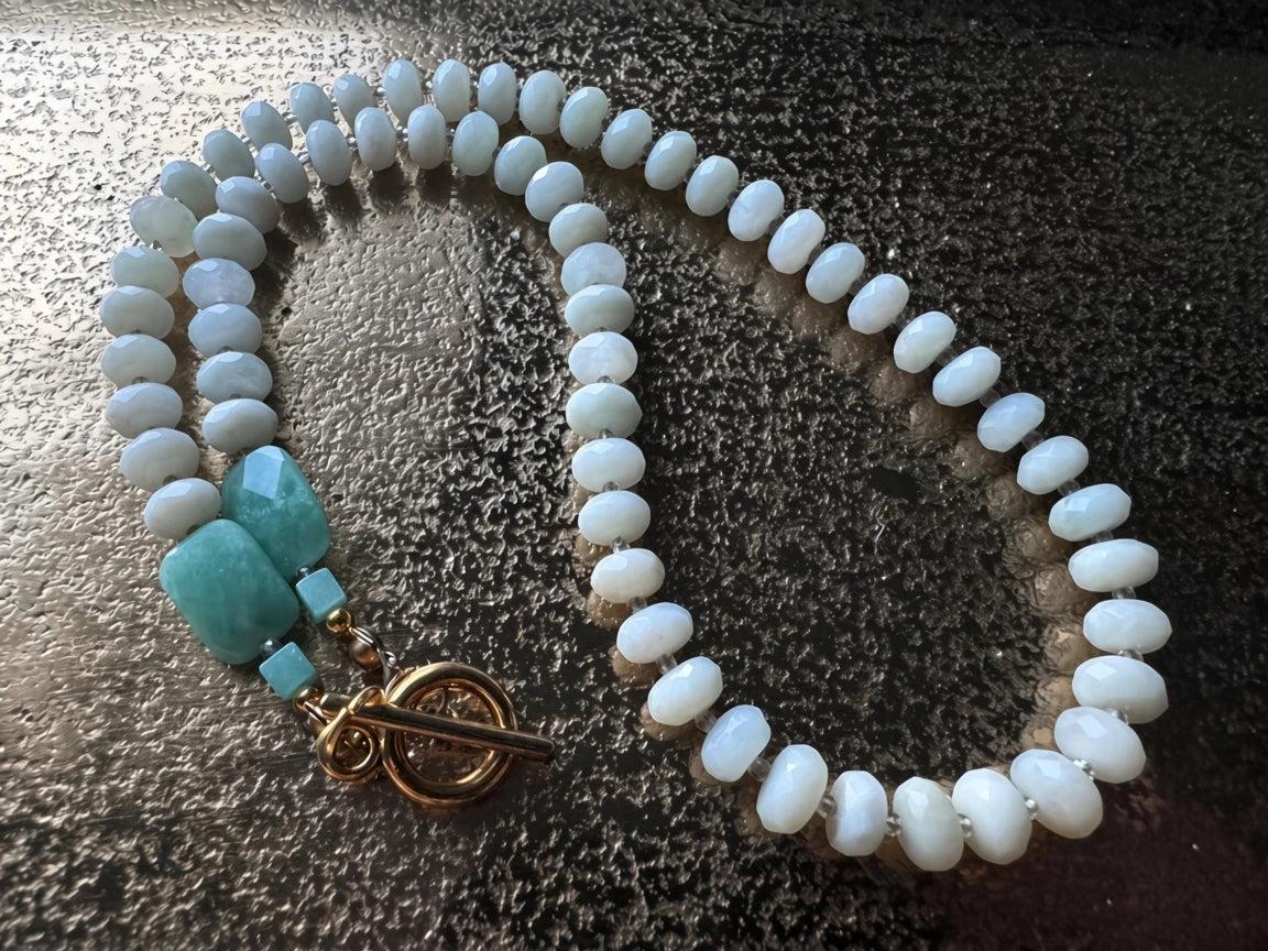 Hue La La Gems beaded necklace with faceted white beads, green gemstone accents, and a gold-tone toggle clasp.