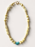 Hue La La Gems statement necklace with honey-toned gemstone beads, gold-tone spacers, and a central turquoise stone.