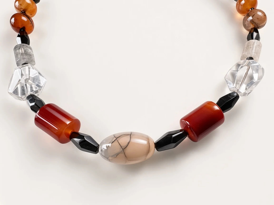 Hue La La Gems artisan statement necklace featuring carnelian, clear quartz, agate, and obsidian beads on white