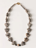 Hue La La Gems artisan statement necklace with patterned jasper-style stone beads and a gold toggle clasp.