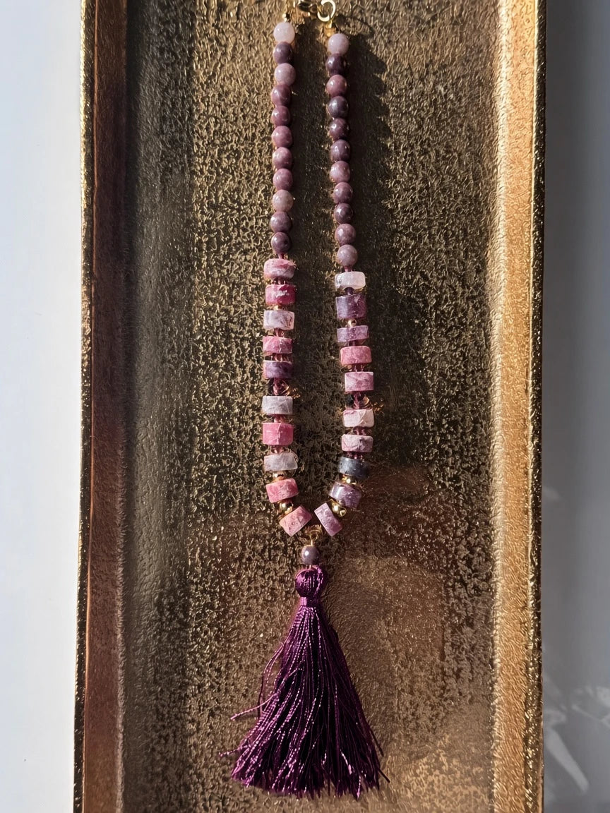 Hue La La Gems beaded statement necklace featuring plum, mauve, and rose stone beads with a deep purple silk tassel.