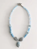 Hue La La Gems handcrafted statement necklace with blue aquamarine beads, crystal spacers, and silver toggle clasp.
