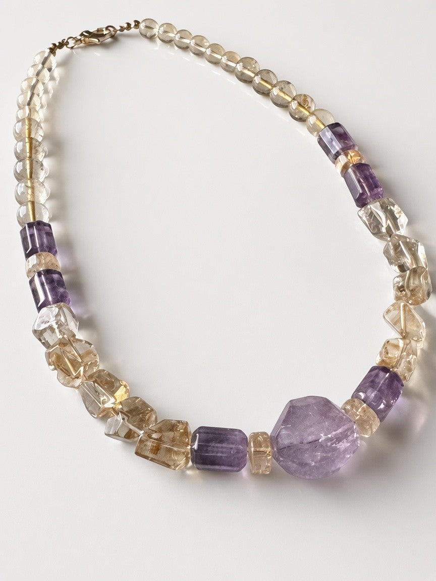 Hue La La Gems handcrafted statement necklace featuring natural citrine and amethyst beads in mixed shapes and sizes.