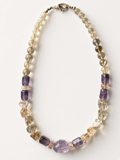 Hue La La Gems handcrafted statement necklace featuring natural citrine and amethyst beads in varied shapes.