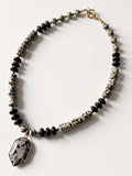 Hue La La Gems statement necklace featuring dalmatian jasper and matte black beads with a geometric pendant