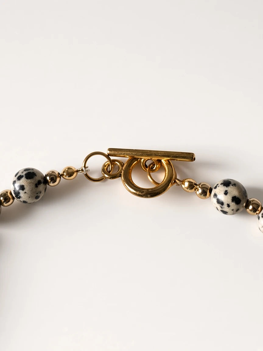 Hue La La Gems beaded statement necklace featuring dalmatian jasper beads and a polished gold-tone toggle clasp.