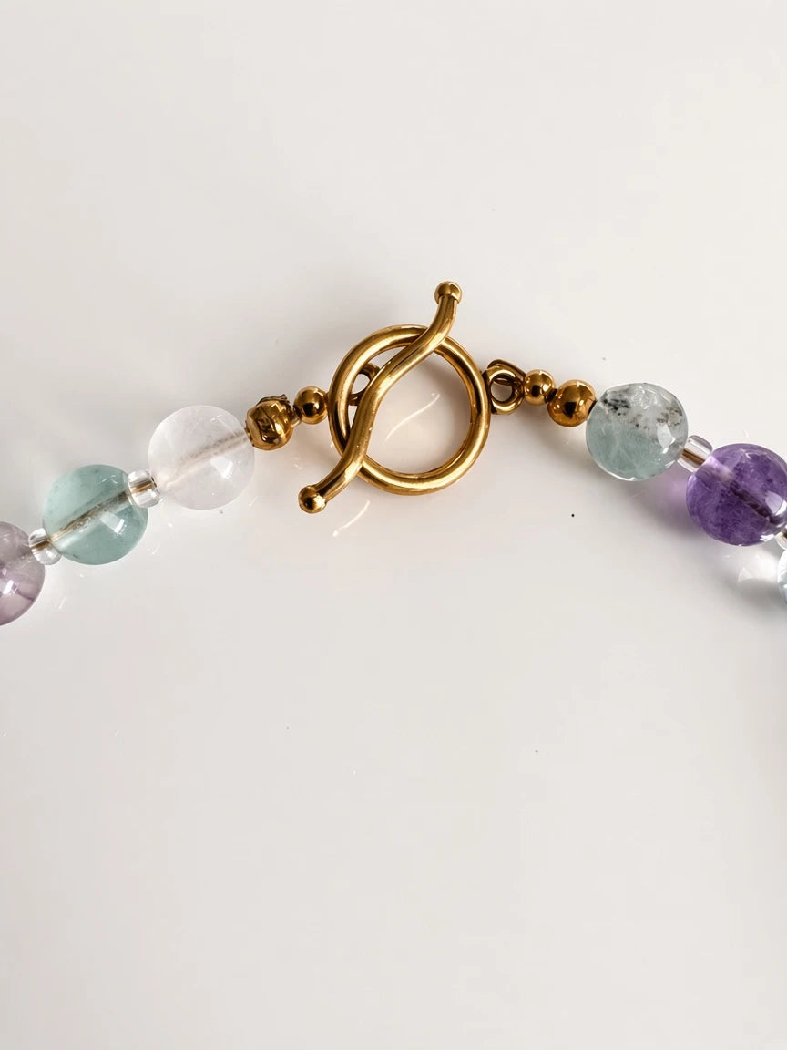 Hue La La Gems fluorite beaded necklace featuring multi-colored gemstone beads and a gold-tone toggle clasp closure.