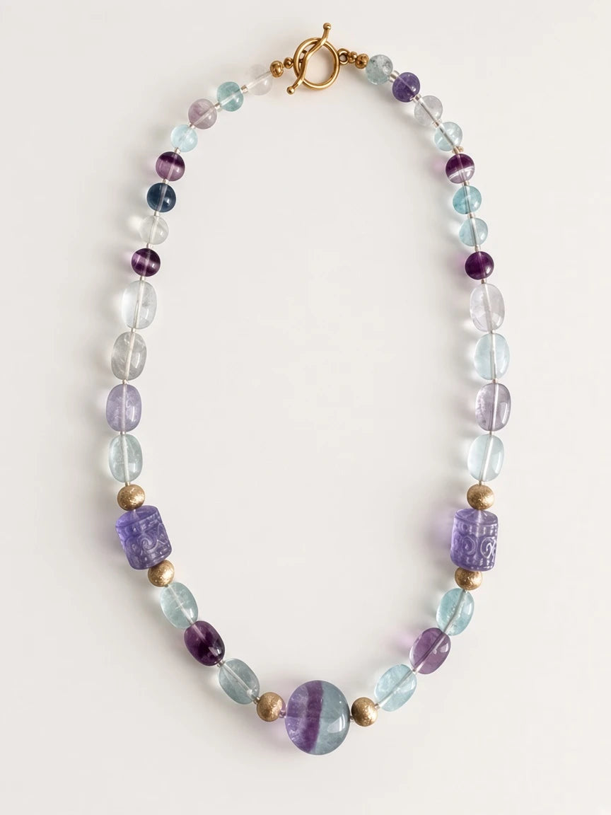 Hue La La Gems fluorite beaded statement necklace with purple and green stones, gold-tone spacers, and toggle clasp.