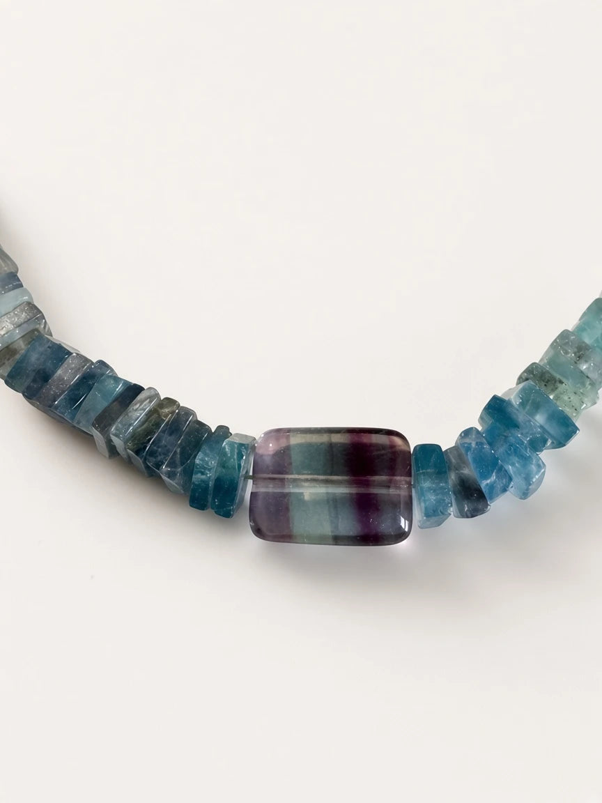 Hue La La Gems multi-colored fluorite beaded necklace featuring flat disc beads and a rectangular focal stone
