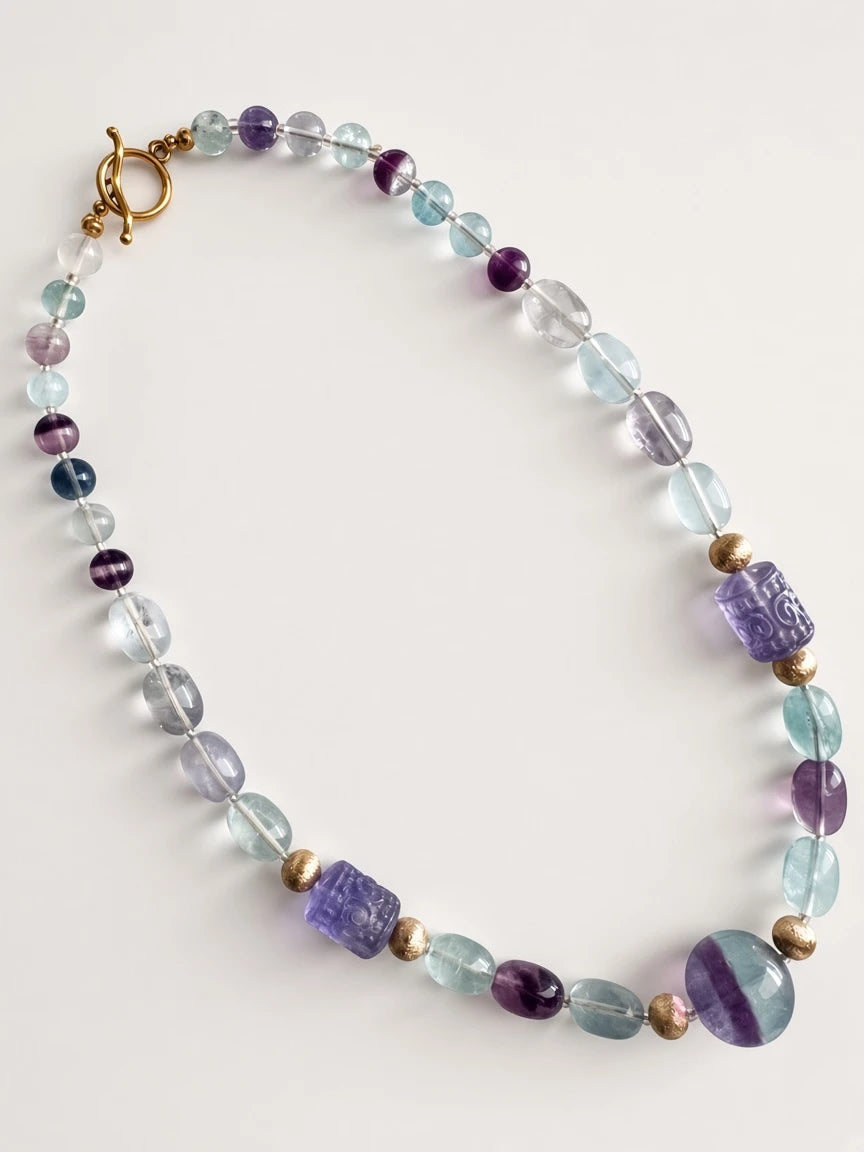 Hue La La Gems fluorite beaded statement necklace with purple and green stones, carved beads, and gold-tone toggle clasp