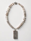 Hue La La Gems handcrafted statement necklace featuring a rectangular fossilized coral pendant and moonstone-style beads.