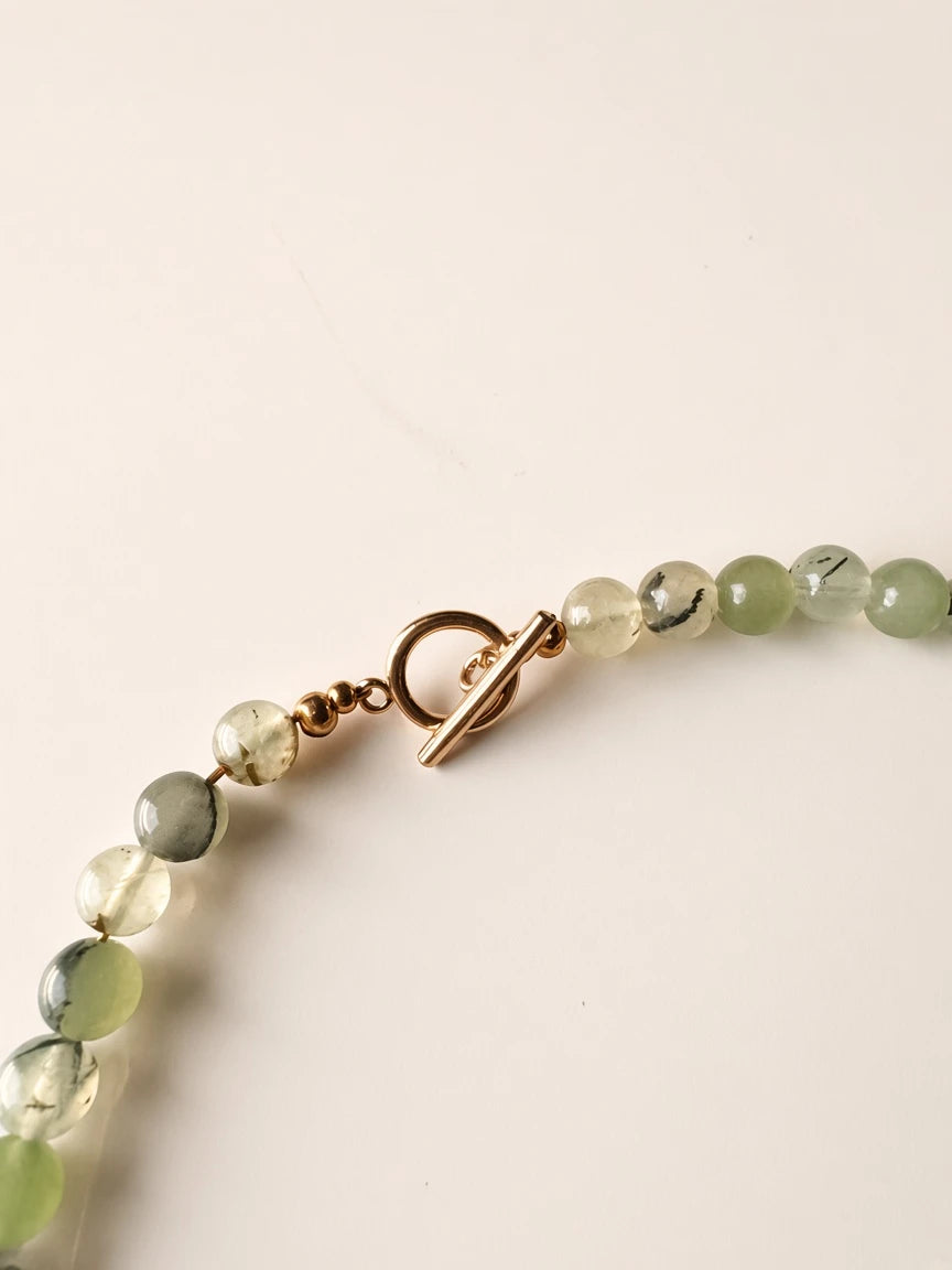 Hue La La Gems beaded statement necklace featuring pale green gemstone beads and a gold-tone toggle clasp closure.
