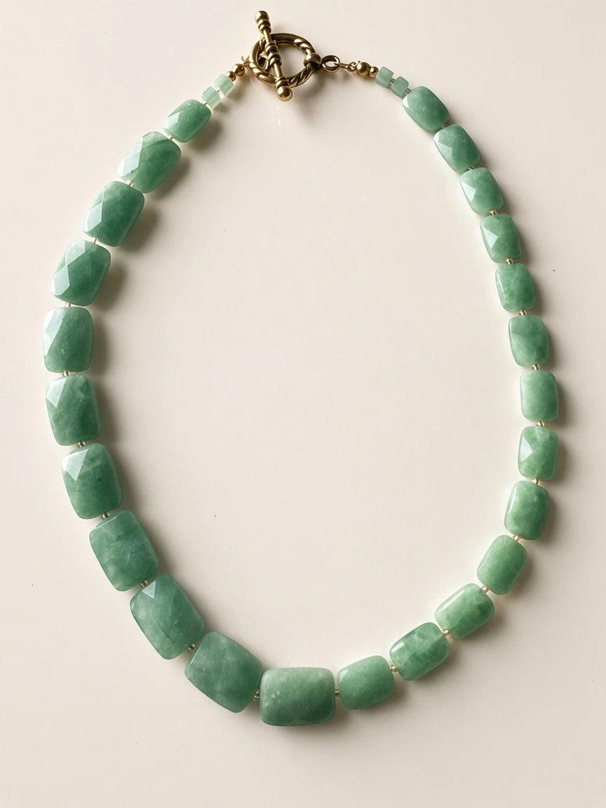 Hue La La Gems statement necklace featuring faceted green jade rectangular beads and a gold-tone toggle clasp.