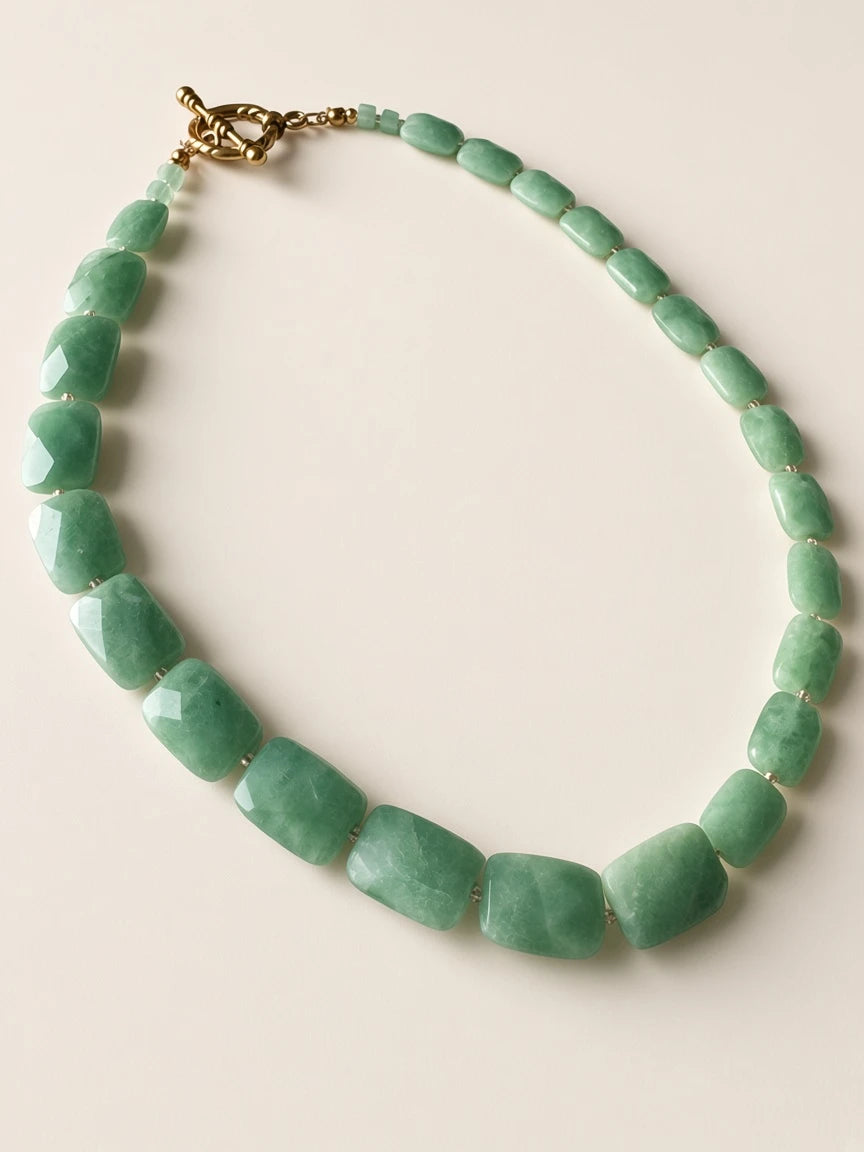 Hue La La Gems statement necklace featuring faceted green jade rectangular beads and a gold-tone toggle clasp.