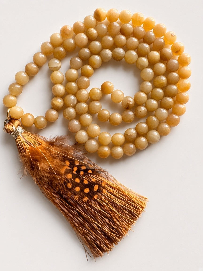 Hue La La Gems honey-toned gemstone beaded necklace with a decorative brown and gold feather tassel pendant