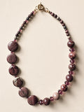 Hue La La Gems statement necklace featuring mauve and plum natural stone beads with faceted crystals and gold toggle