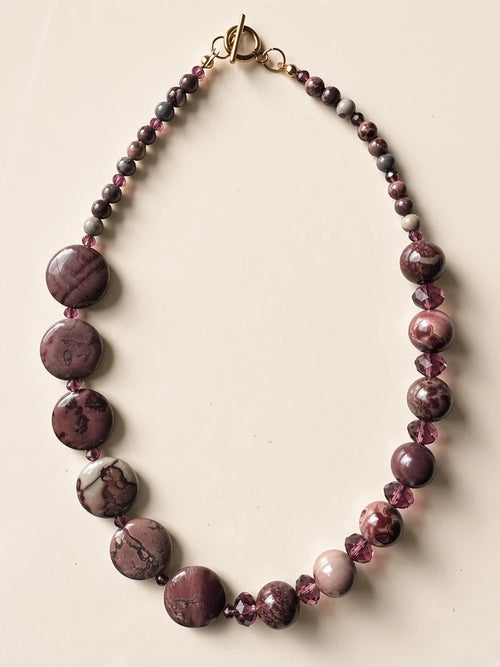 Hue La La Gems statement necklace featuring mauve and plum natural stone beads with faceted crystals and gold toggle