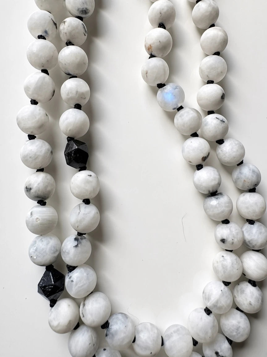 Hue La La Gems mala necklace featuring white moonstone beads and black tourmaline accents on a durable black cord.