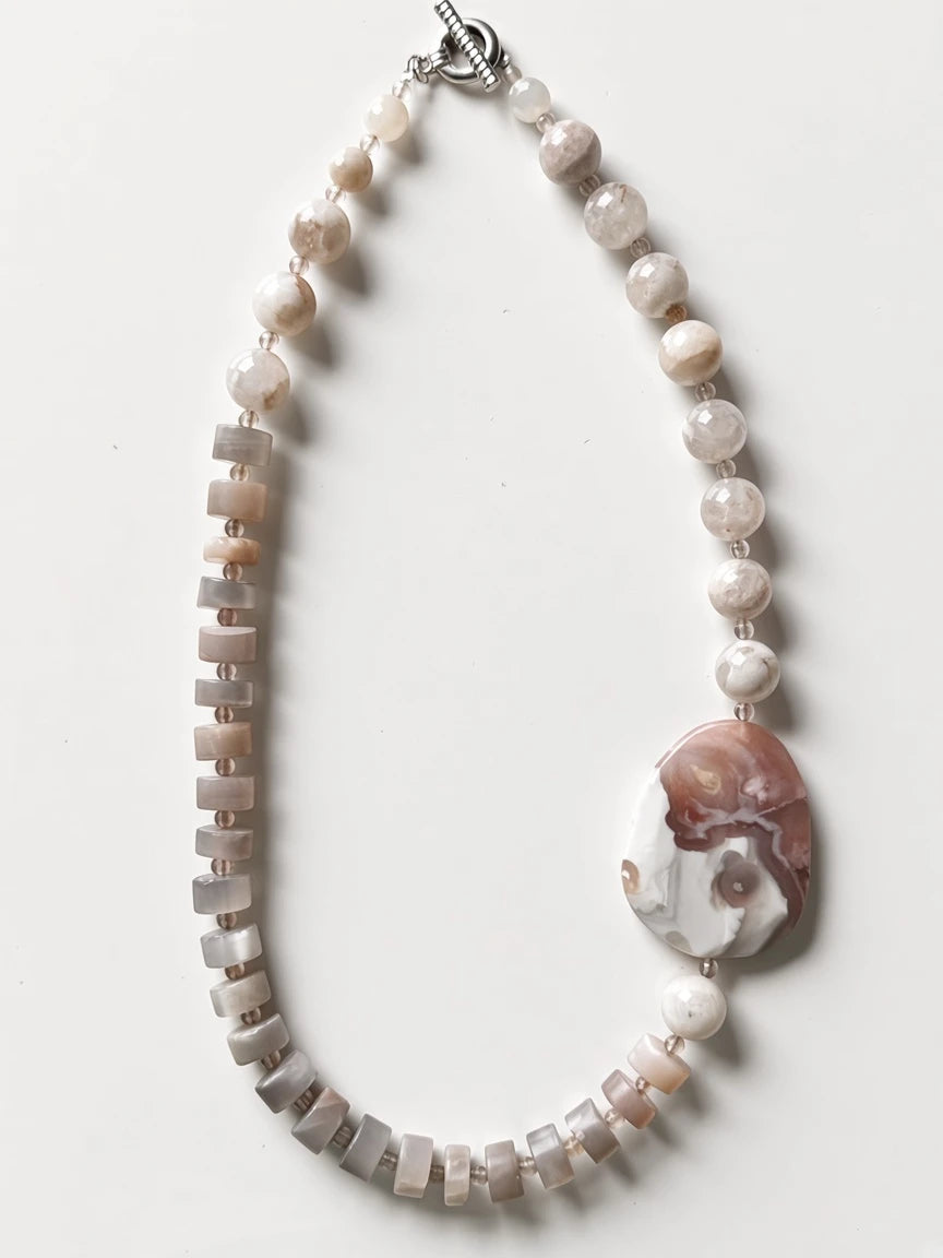 Hue La La Gems handcrafted statement necklace with neutral semi-precious stone beads and a large polished focal stone.