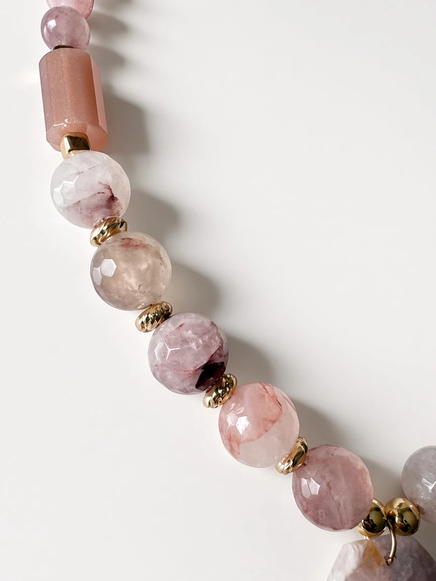 Hue La La Gems beaded statement necklace featuring faceted pink gemstone beads and polished gold-tone spacers.