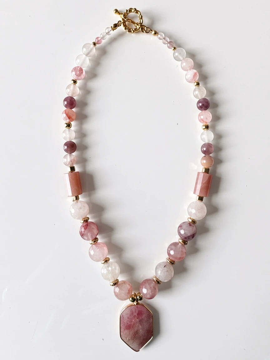 Hue La La Gems beaded statement necklace with pink gemstone beads, gold-tone spacers, and a geometric pendant.