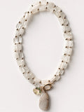 Hue La La Gems beaded statement necklace with clear quartz, gold-tone spacers, stone pendant, and floral charm.