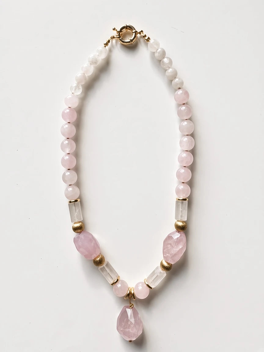Hue La La Gems beaded statement necklace with rose quartz, clear quartz, and gold-tone accents on a white background.