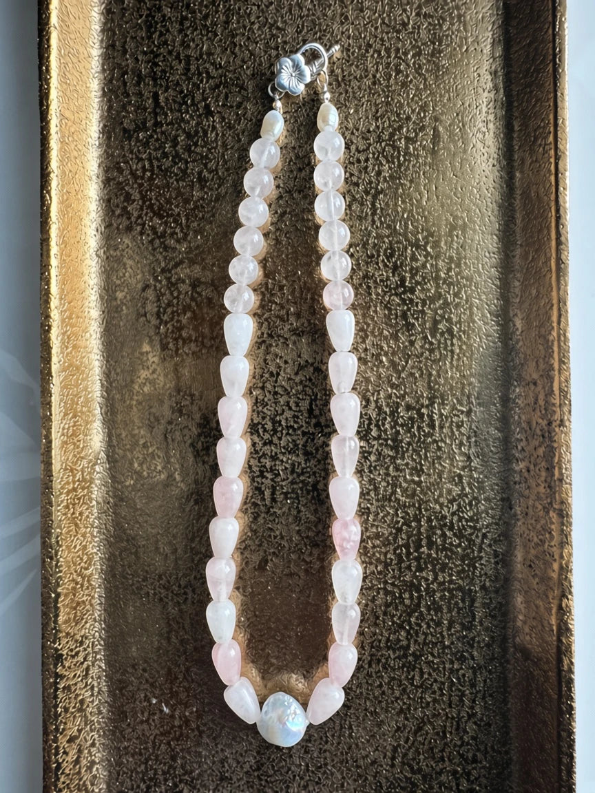 Hue La La Gems handcrafted necklace with teardrop rose quartz beads, a baroque pearl, and a silver floral toggle clasp.