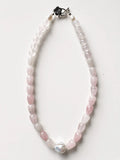 Hue La La Gems handcrafted rose quartz teardrop bead necklace with a baroque pearl center and floral silver clasp.