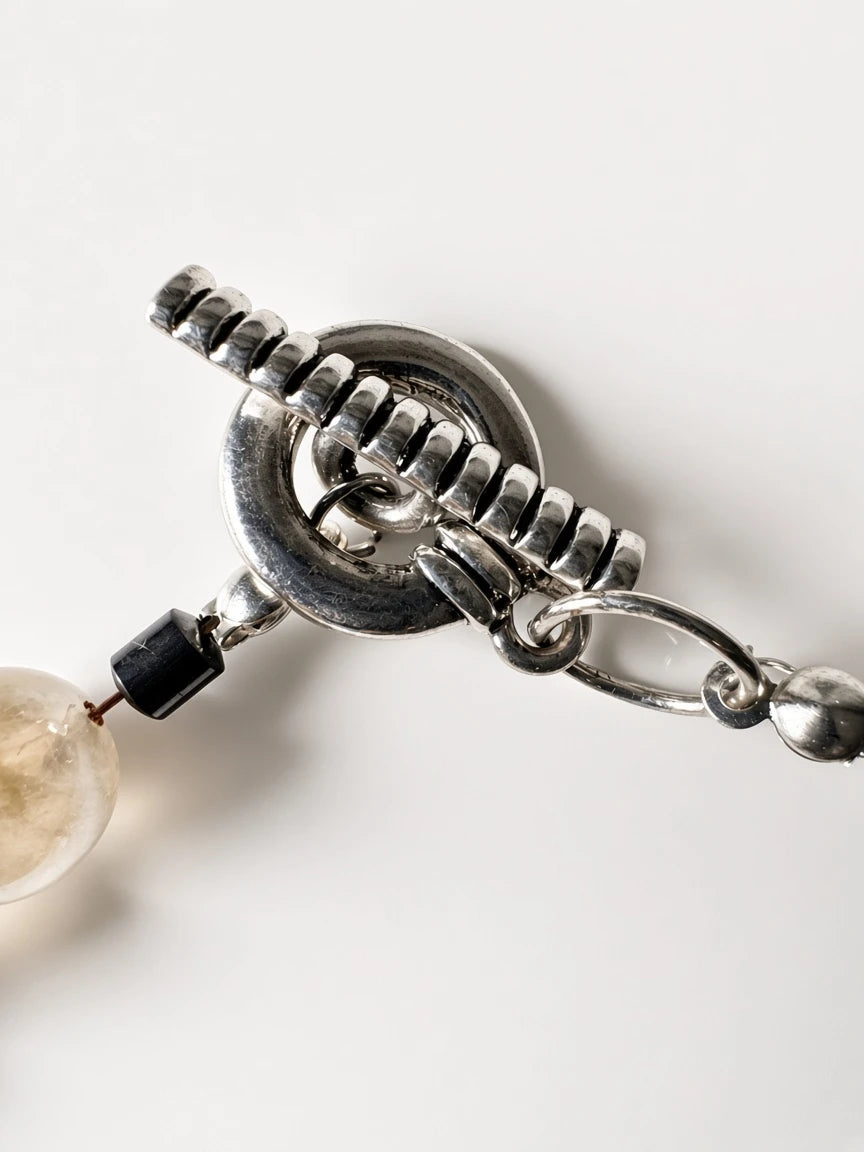 Hue La La Gems artisan statement necklace featuring a silver-tone toggle clasp and natural gemstone beads.