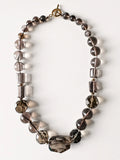 Hue La La Gems statement necklace featuring smoky quartz beads in taupe and charcoal with a gold-tone toggle clasp.